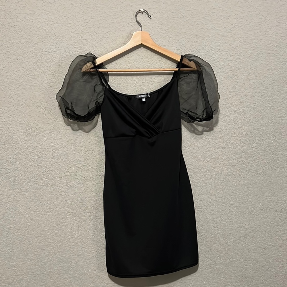 Black dress with puffed sleeves. Never worn with tags!